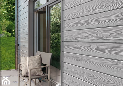 Aranżacje - Mały z podłoga z płyt betonowych z meblami ogrodowymi taras z tyłu domu, styl minimalistyczny - zdjęcie od CEDRAL