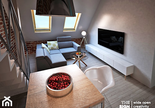 Piętrowe mieszkanie w kamienicy - Mały szary salon z jadalnią, styl skandynawski - zdjęcie od The Sign