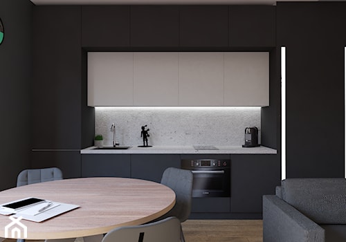 Port Praski - Średnia otwarta z salonem z kamiennym blatem czarna szara z zabudowaną lodówką z lodówką wolnostojącą z nablatowym zlewozmywakiem kuchnia jednorzędowa z marmurem nad blatem kuchennym, styl minimalistyczny - zdjęcie od Studio 36m2