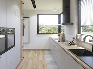 Dom w Siedlcach - Średnia biała z zabudowaną lodówką z nablatowym zlewozmywakiem kuchnia dwurzędowa z oknem, styl nowoczesny - zdjęcie od SSF_Interiors