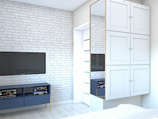 Przytulna sypialnia z białą cegłą na ścianie