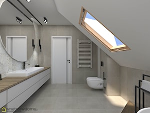 Okrągłe duże lustro i okno dachowe w łazience ze skosami - zdjęcie od wnetrzewdomu