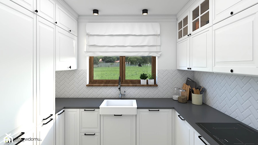 Salon z kuchnią w kolorach bieli z dodatkiem granatu - zdjęcie od wnetrzewdomu