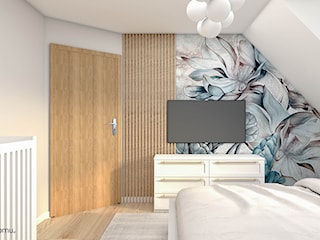 Nowoczesna , elegancka sypialnia z ozdobną tapetą