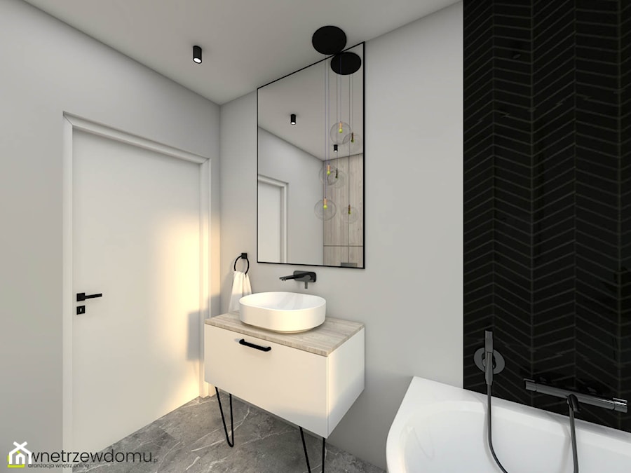 Nowoczesna łazienka z czarnymi płytkami ułożonymi w formie jodełki - zdjęcie od wnetrzewdomu