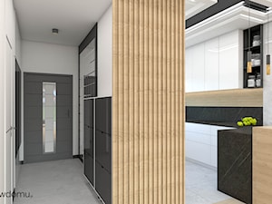 Połączenie cegły i kamienia w salonie z kuchnią - zdjęcie od wnetrzewdomu
