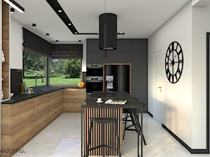 Salon z kuchnią w drewnianym wykończeniu - zdjęcie od wnetrzewdomu