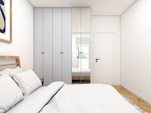 Minimalisstyczna sypialnia z drewnianym łóżkiem - zdjęcie od wnetrzewdomu