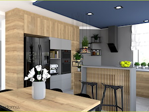 Duży salon z kuchnią z niebieskimi dodatkami - zdjęcie od wnetrzewdomu