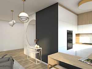 Jasny, nowoczesny salon z aneksem kuchennym z dodatkiem marmuru ze złotą nitką - zdjęcie od wnetrzewdomu