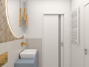 Niewielka jasna łazienka ze złotymi dodatkami - zdjęcie od wnetrzewdomu
