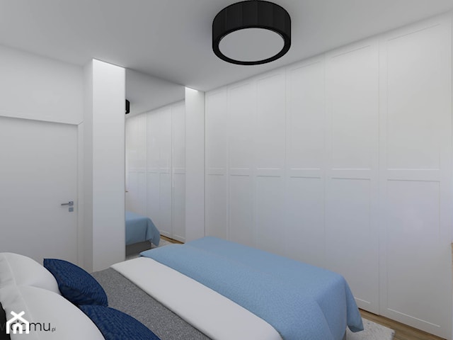 Przytulna sypialnia z niebieską lamperią