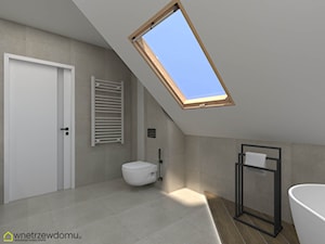 Okrągłe duże lustro i okno dachowe w łazience ze skosami