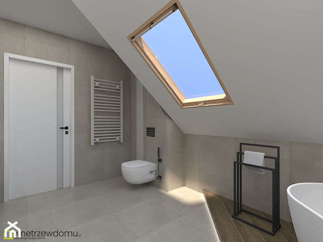 Okrągłe duże lustro i okno dachowe w łazience ze skosami