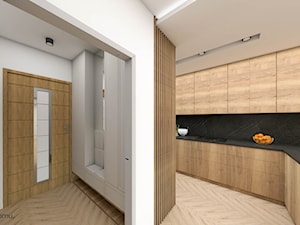Połączenie drewna i betonu z różem w salonie z kuchnią