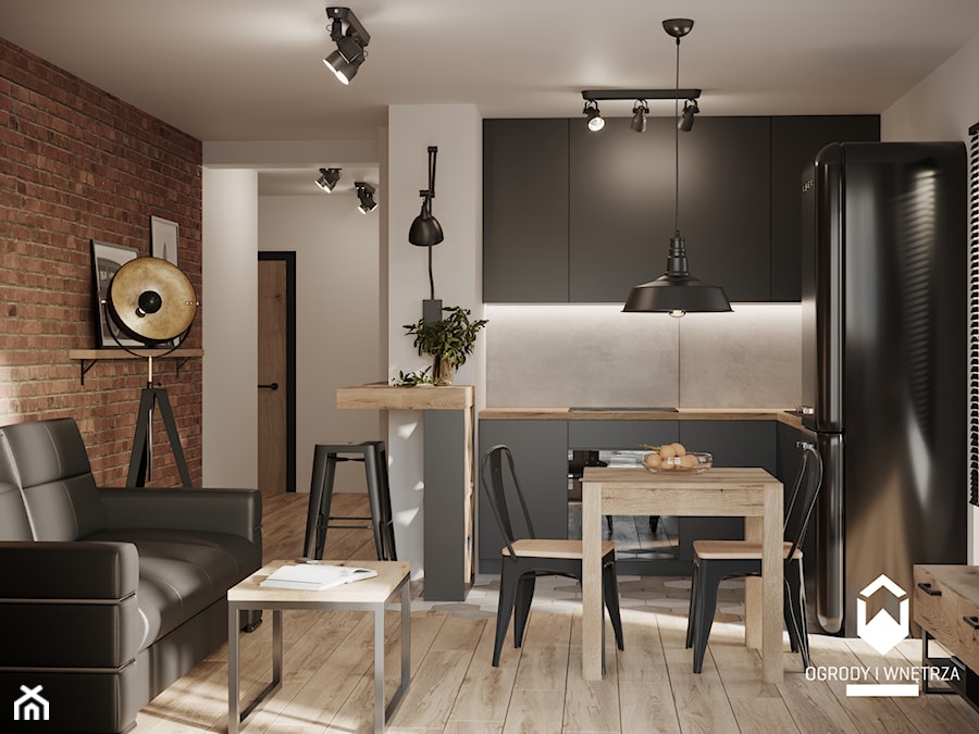Salon z czarnym aneksem kuchennym i cegiełką - zdjęcie od KAROLINA POPIEL - ARCHITEKTURA WNĘTRZ