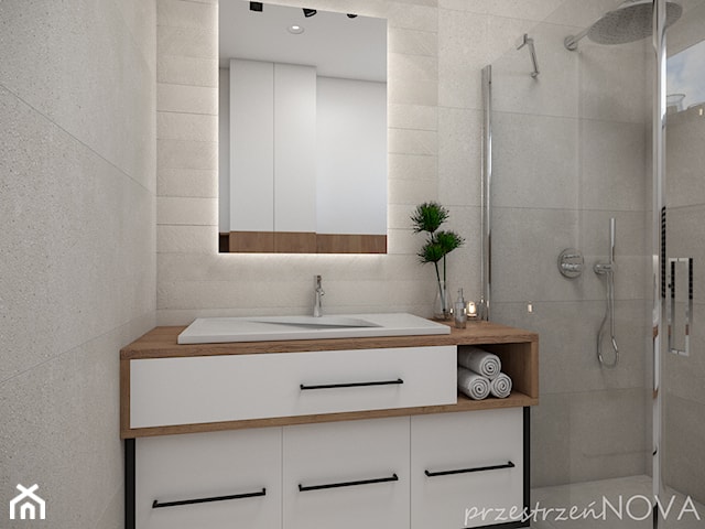 Mała łazienka z prysznicem -beż, biel oraz czarne akcenty