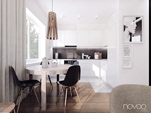 004_16 MIELEC - Średnia otwarta z kamiennym blatem biała z zabudowaną lodówką kuchnia w kształcie litery l z oknem, styl nowoczesny - zdjęcie od NOVOO studio