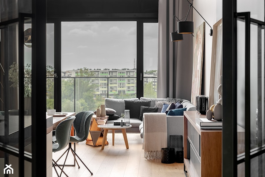 Dwupoziomowy apartament na Warszawskim Żoliborzu - Średnia biała jadalnia w salonie, styl nowoczesny - zdjęcie od JMW Architekci