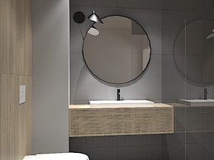 Łazienka z okrągłym lustrem - zdjęcie od Vosa Studio