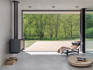 Bardzo nowoczesny dom - Średni szary salon z tarasem / balkonem, styl nowoczesny - zdjęcie od Studio de.materia