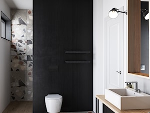 Łazienka w szarościach bieli z czarnymi dodatkami - zdjęcie od igloo studio