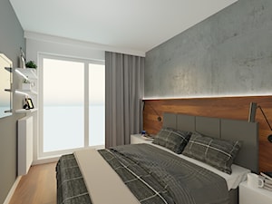 Sypialnia z surową betonową ścianą