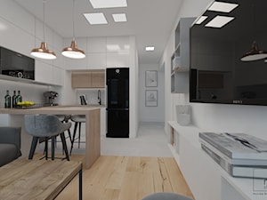 salon z kuchnią - zdjęcie od mo.studio