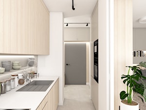 Mieszkanie na warszawskiej Woli - Mała zamknięta z salonem biała z zabudowaną lodówką z nablatowym zlewozmywakiem kuchnia dwurzędowa, styl nowoczesny - zdjęcie od AxisDesign