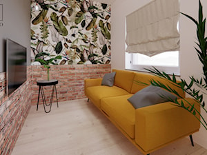 Salon w apartamencie z żółtą sofą - zdjęcie od studio98