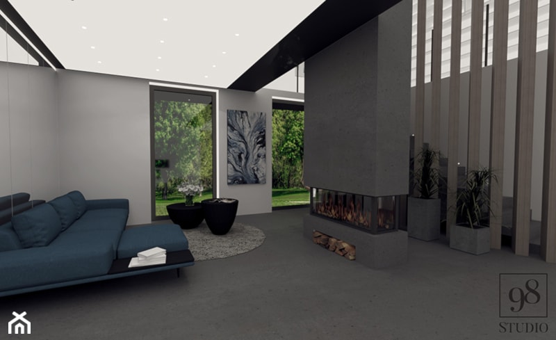 Nowoczesny salon w domu z elementami betonu i niebieskim narożnikiem - zdjęcie od studio98