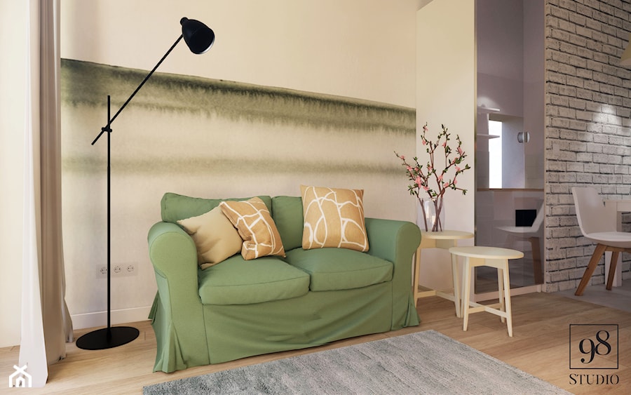 Rozkładana sofa w zielonym kolorze - zdjęcie od studio98