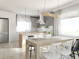 Salon i kuchnia z bielą i drewnem - zdjęcie od Pracownia Aranżacji Wnętrz "O-kreślarnia"