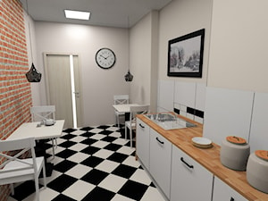 Kuchnia w biurze w kamienicy z czarno-białą pogłogą i cegłą - zdjęcie od Pracownia Aranżacji Wnętrz "O-kreślarnia"
