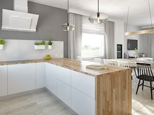 Salon i kuchnia z bielą i drewnem - zdjęcie od Pracownia Aranżacji Wnętrz "O-kreślarnia"