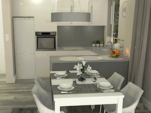 Jasna kuchnia z jadalnią - zdjęcie od EM Projektowanie Wnętrz