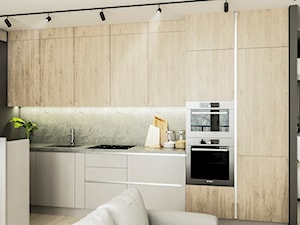 WNĘTRZA MIESZKANIA- GRODZISK MAZOWIECKI - Mała otwarta z salonem czarna szara z zabudowaną lodówką z podblatowym zlewozmywakiem kuchnia dwurzędowa, styl minimalistyczny - zdjęcie od AP KWADRAT