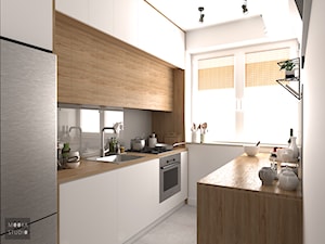 Mieszkanie w Warszawie - Mała otwarta szara z zabudowaną lodówką z nablatowym zlewozmywakiem kuchnia dwurzędowa z oknem, styl nowoczesny - zdjęcie od MOOKA Studio