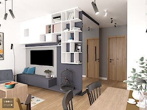 Mieszkanie w Warszawie - Mały biały czarny salon z jadalnią, styl skandynawski - zdjęcie od MOOKA Studio