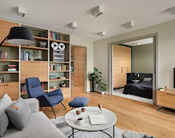 Mieszkanie projektu IP-Design - Średni beżowy salon z bibiloteczką, styl nowoczesny - zdjęcie od Mikołaj Dąbrowski - Homebook