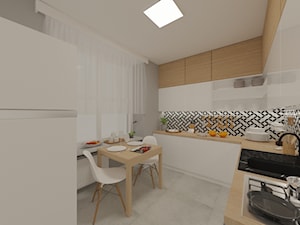 Projekt wnętrz mieszkania przy ul. Puławskiej - Średnia zamknięta szara z zabudowaną lodówką z nablatowym zlewozmywakiem kuchnia w kształcie litery l z oknem, styl nowoczesny - zdjęcie od PROJEKTOWNIA Małgorzata Woldańska