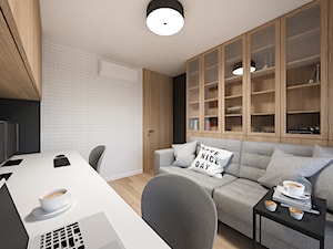 PROJEKT | KRAKÓW, ZABŁOCIE, ATAL RESIDENCE - MIESZKANIE - Małe w osobnym pomieszczeniu z sofą z zabudowanym biurkiem białe czarne biuro, styl nowoczesny - zdjęcie od MIRAI STUDIO