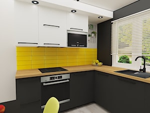 Kuchnia z żółtym akcentem - Średnia otwarta biała czarna z zabudowaną lodówką z nablatowym zlewozmywakiem kuchnia w kształcie litery l z oknem, styl nowoczesny - zdjęcie od JTG Design