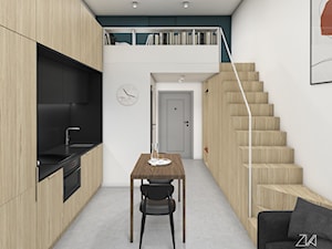 Mikromieszkanie z antresolą - Średnia otwarta z kamiennym blatem biała czarna z zabudowaną lodówką z podblatowym zlewozmywakiem kuchnia jednorzędowa, styl minimalistyczny - zdjęcie od ZKA architekci
