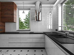 Nowoczesna biała kuchnia stalowy okap wyspowy fronty frezowane bez uchwytów - zdjęcie od Monika Hardej Architekt