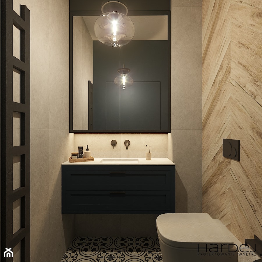 Toaleta w granacie, płytkach w jodłę i patchworkową podłogą - zdjęcie od Monika Hardej Architekt