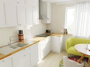 Projekt kuchni w Opalenicy - Mała otwarta z salonem biała z zabudowaną lodówką z nablatowym zlewozmywakiem kuchnia w kształcie litery l z oknem - zdjęcie od STUDIO PODRYS