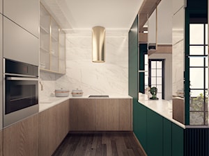 Projekt kuchni w stylu nowoczesnym z zielonym akcentem pod Warszawą - zdjęcie od BOHE Architektura