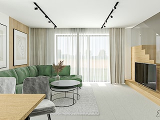 Otwarty salon z zieloną sofą i lamelami