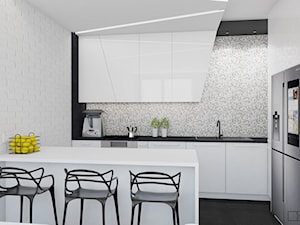 biały apartament - Średnia otwarta czarna szara z zabudowaną lodówką z lodówką wolnostojącą z nablatowym zlewozmywakiem kuchnia w kształcie litery l z wyspą lub półwyspem, styl nowoczesny - zdjęcie od Twój Kwadrat